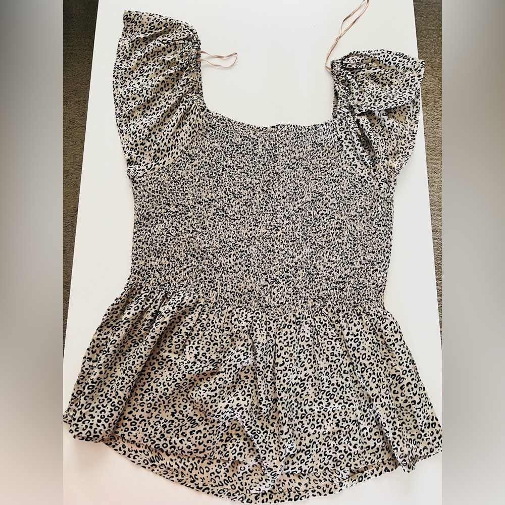 Peplum shirred leopard print top